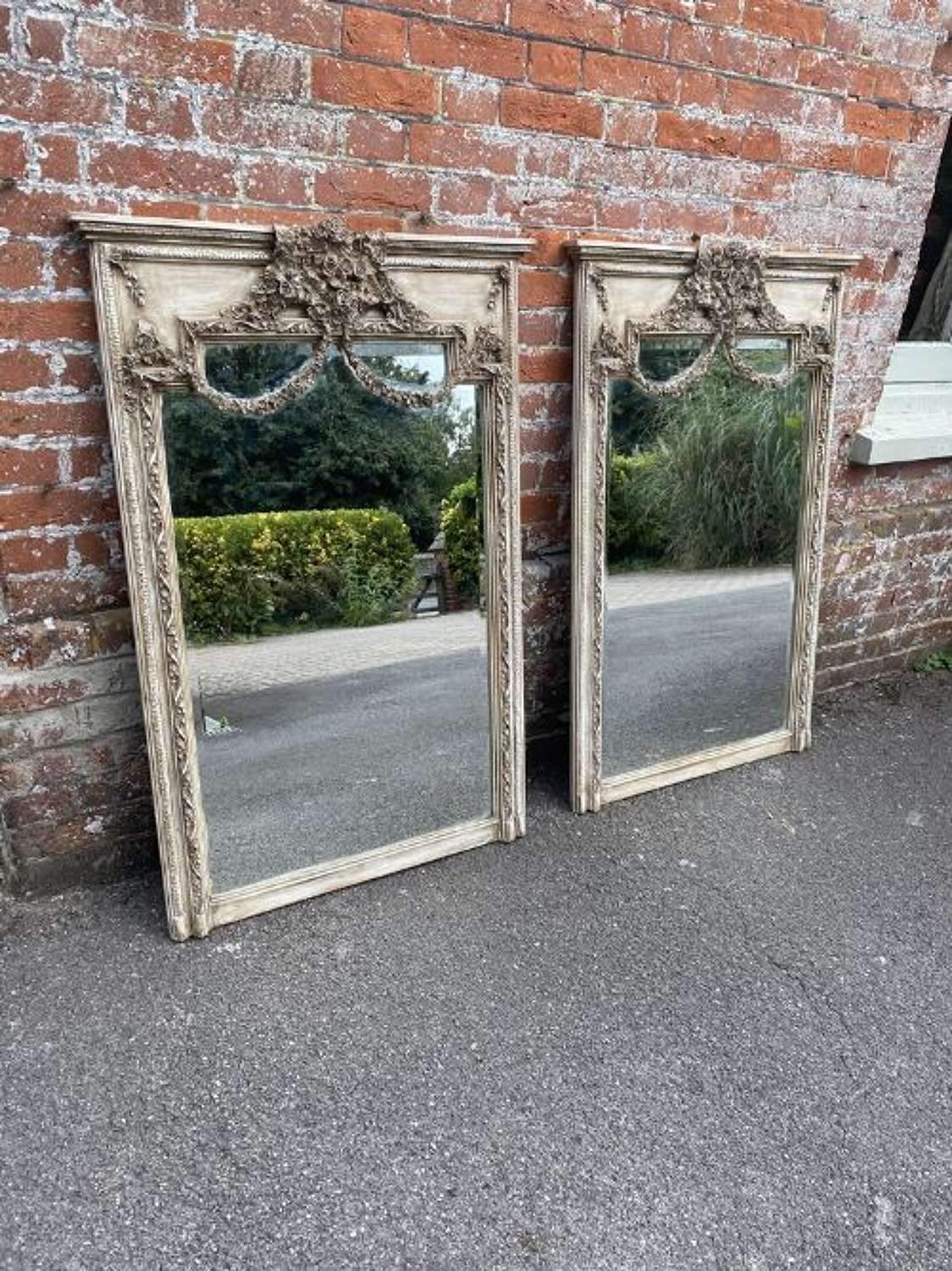 A Stunning Pair of Early 20th Century French Carved Wood Mirrors.