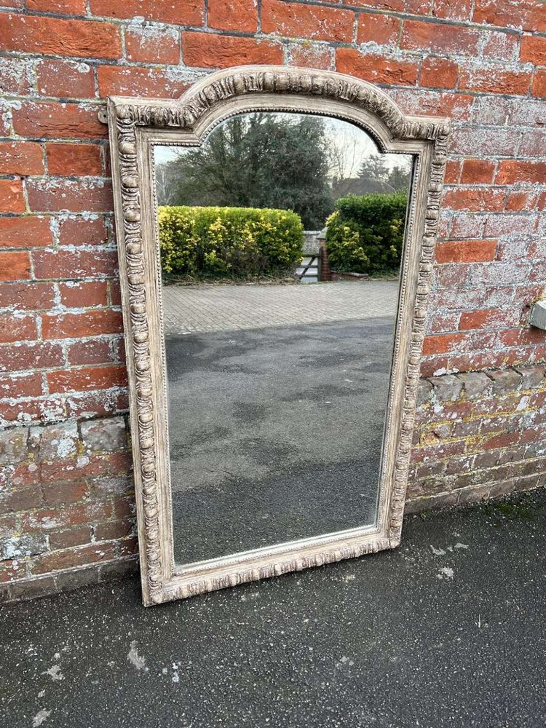A Delightful large Antique French 19th Century shaped top Mirror.