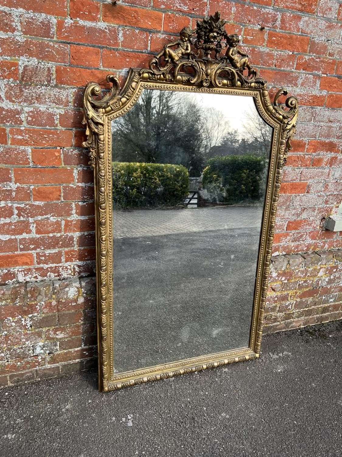 A Superb large Antique French 19th C original gilt shaped top Mirror.