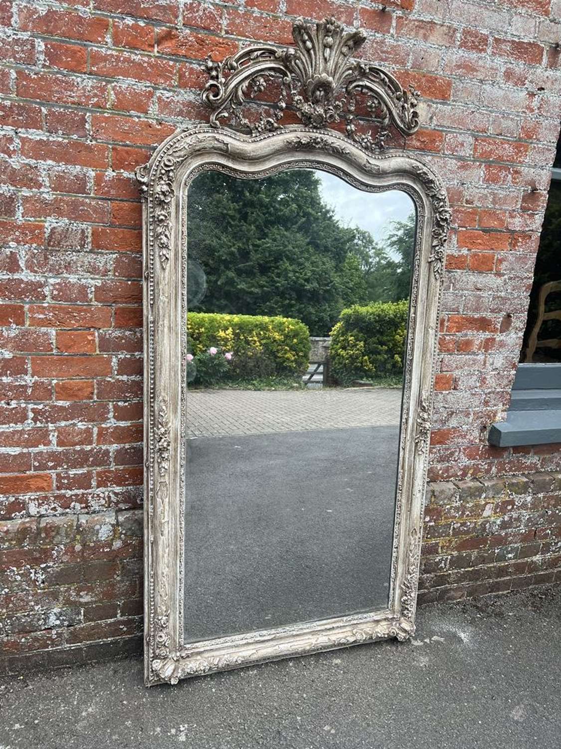 A Spectacular large Antique French 19th Century shaped crested Mirror.