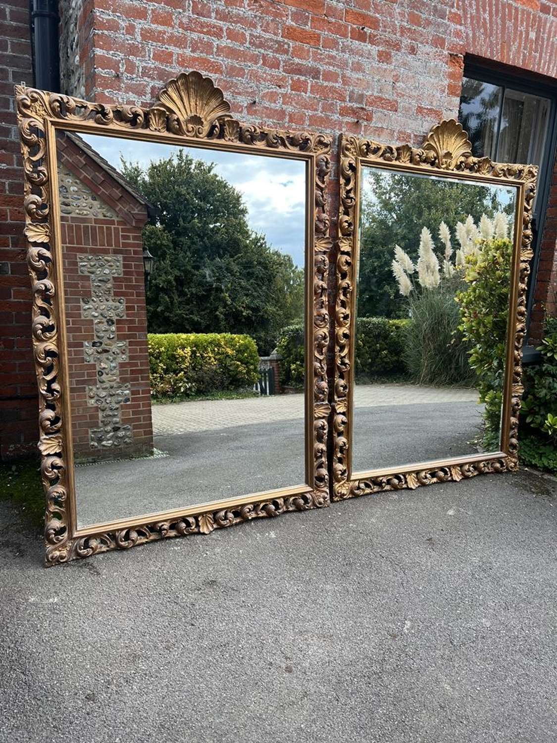 A Delightful Pair of 20th Century carved wood and gilt Mirrors.