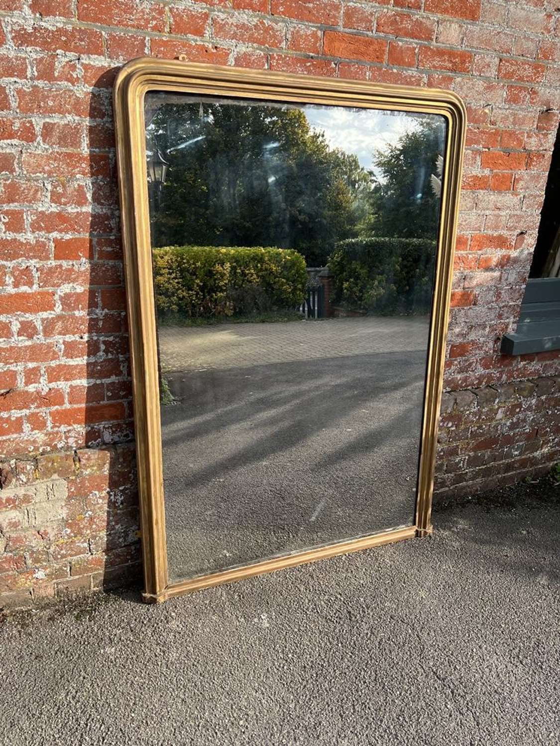 A Spectacular large Antique French 19th C arched top gilt Mirror.