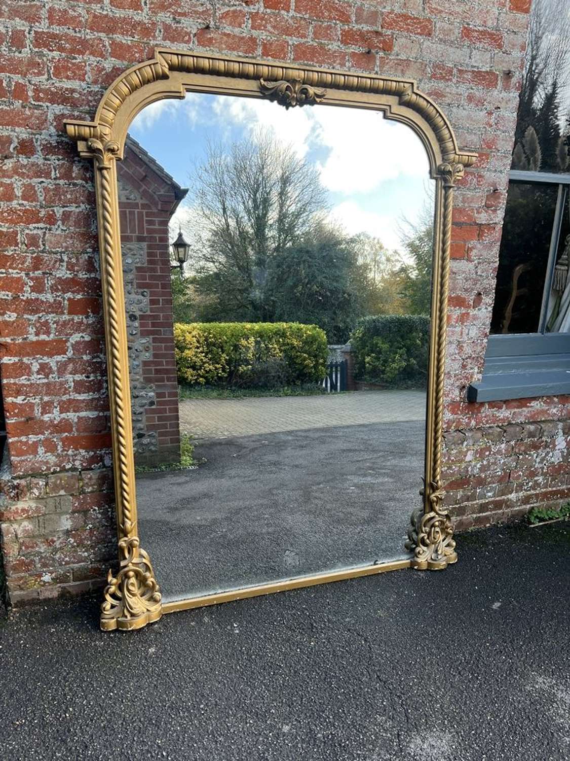 A Spectacular large Antique English 19th C ornate shaped gilt Mirror.
