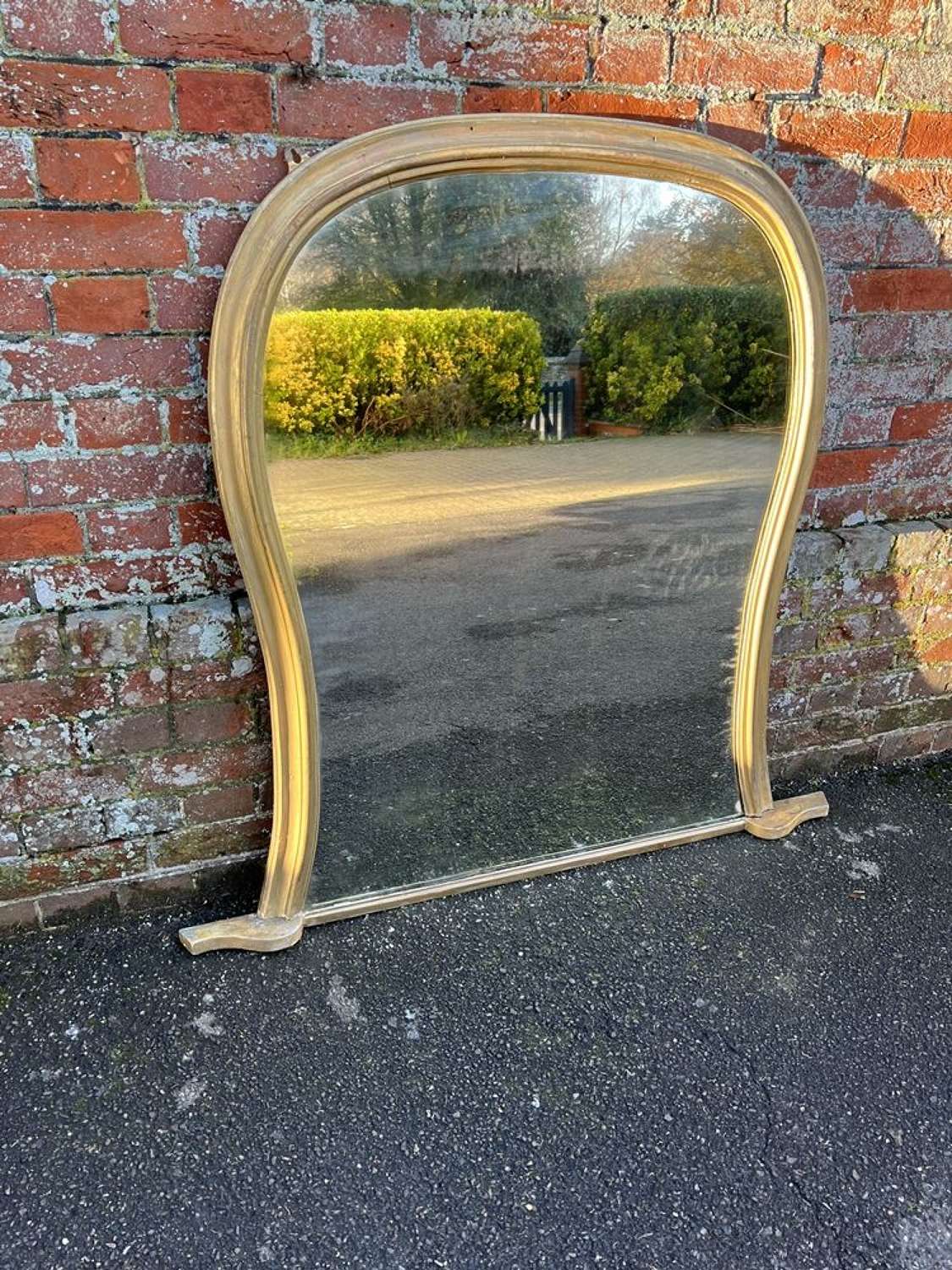 A Stunning large Antique English 19th C gilt shaped Mirror.