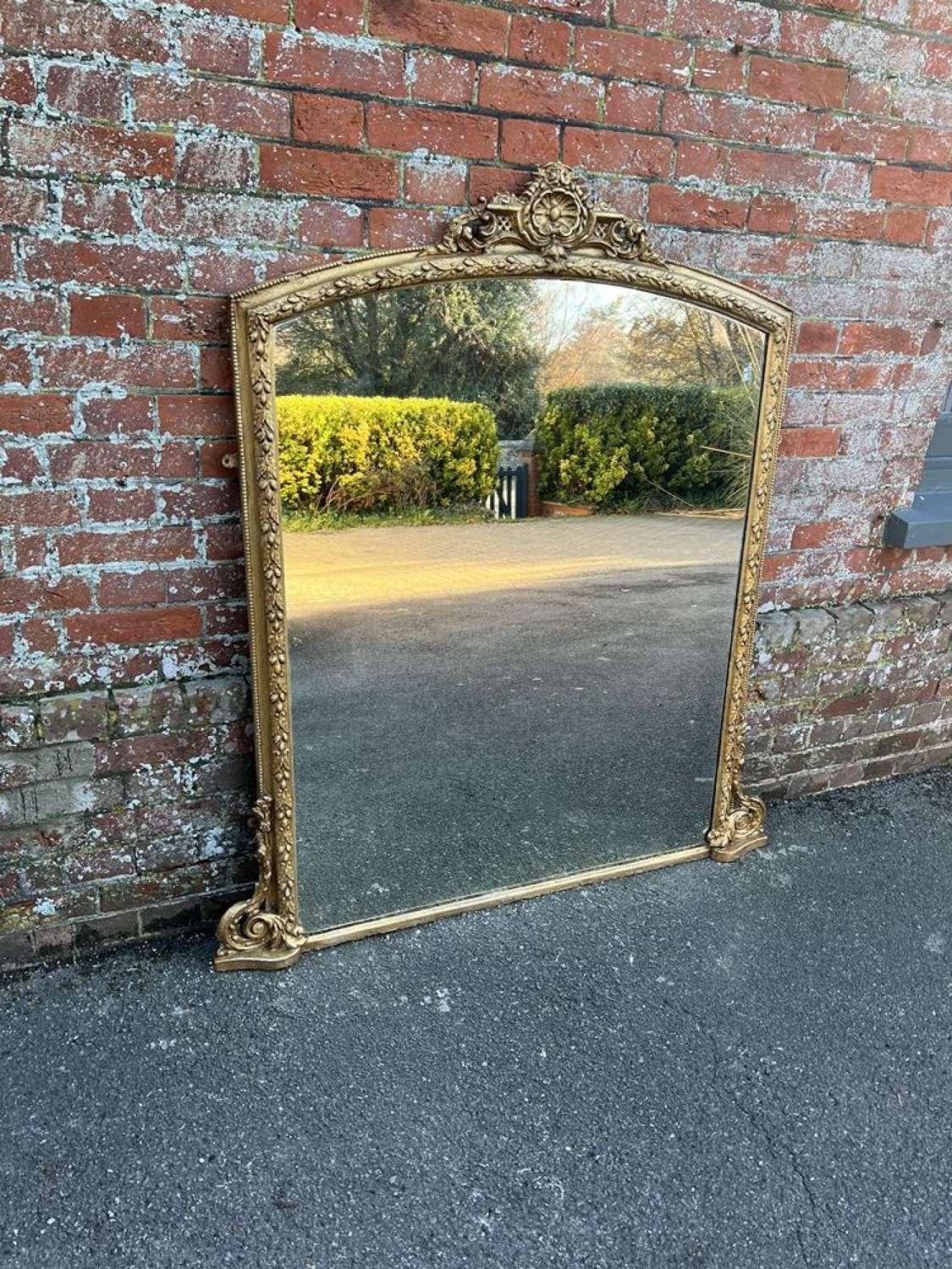 A Wonderful large Antique English 19th C shaped gilt Overmantle Mirror