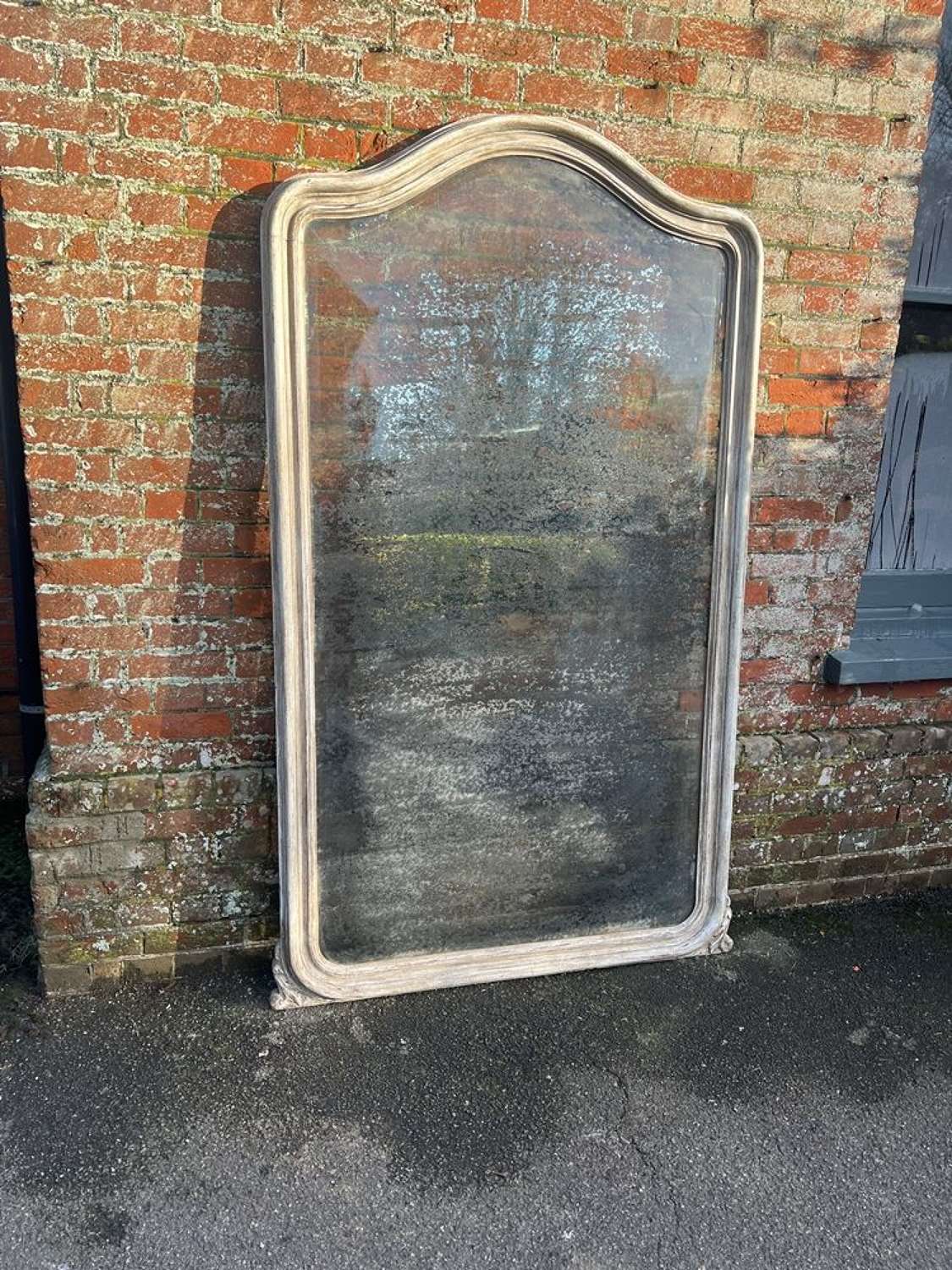 A Superb highly unusual large Antique French 19th C shaped top Mirror.