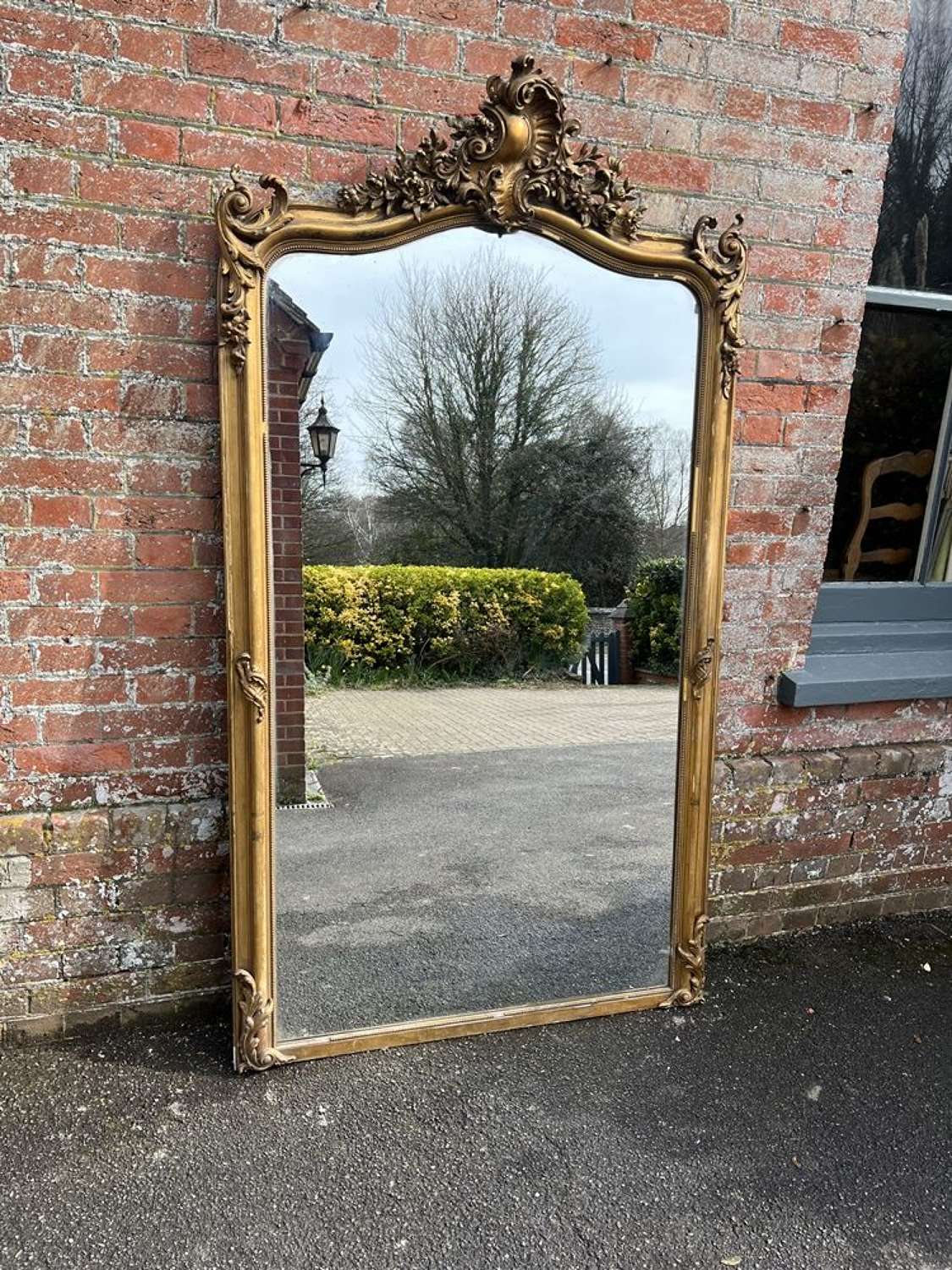 An Exceptional large Antique French 19th C shaped top gilt Mirror.