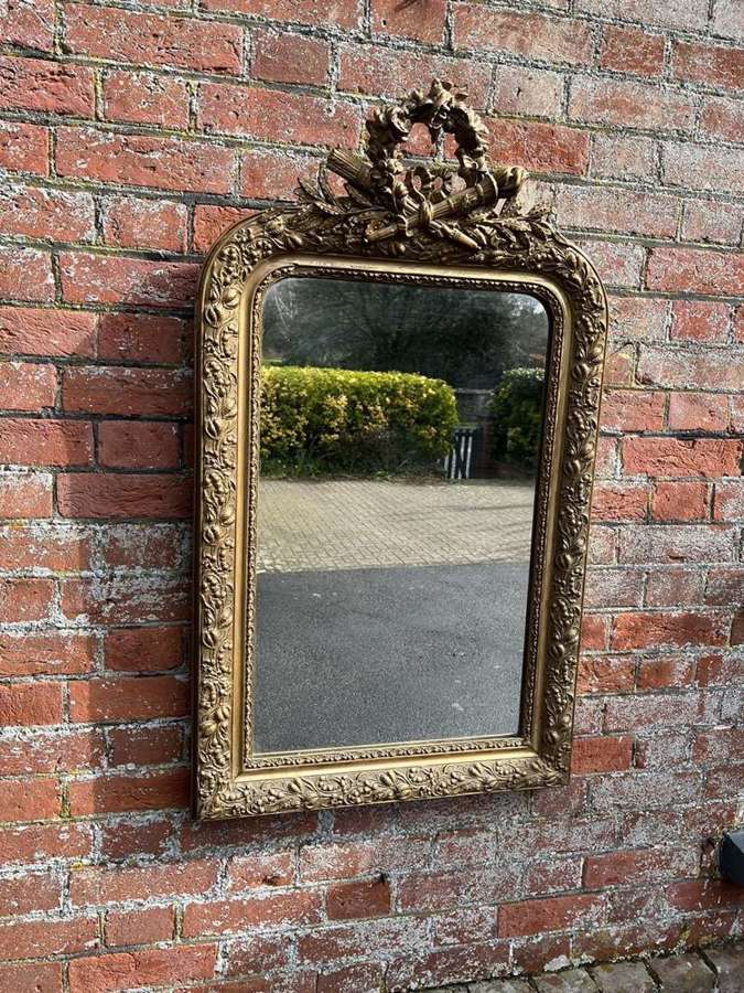 A Fabulous Antique French 19th C arched top gilt crested Mirror.