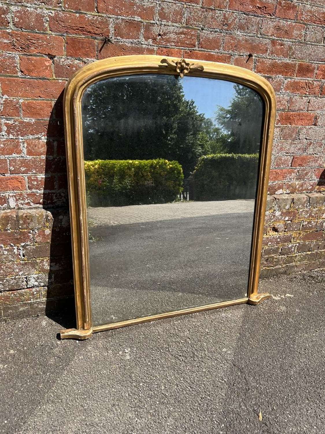 An Exceptional large Antique English 19th C arched top gilt Mirror.