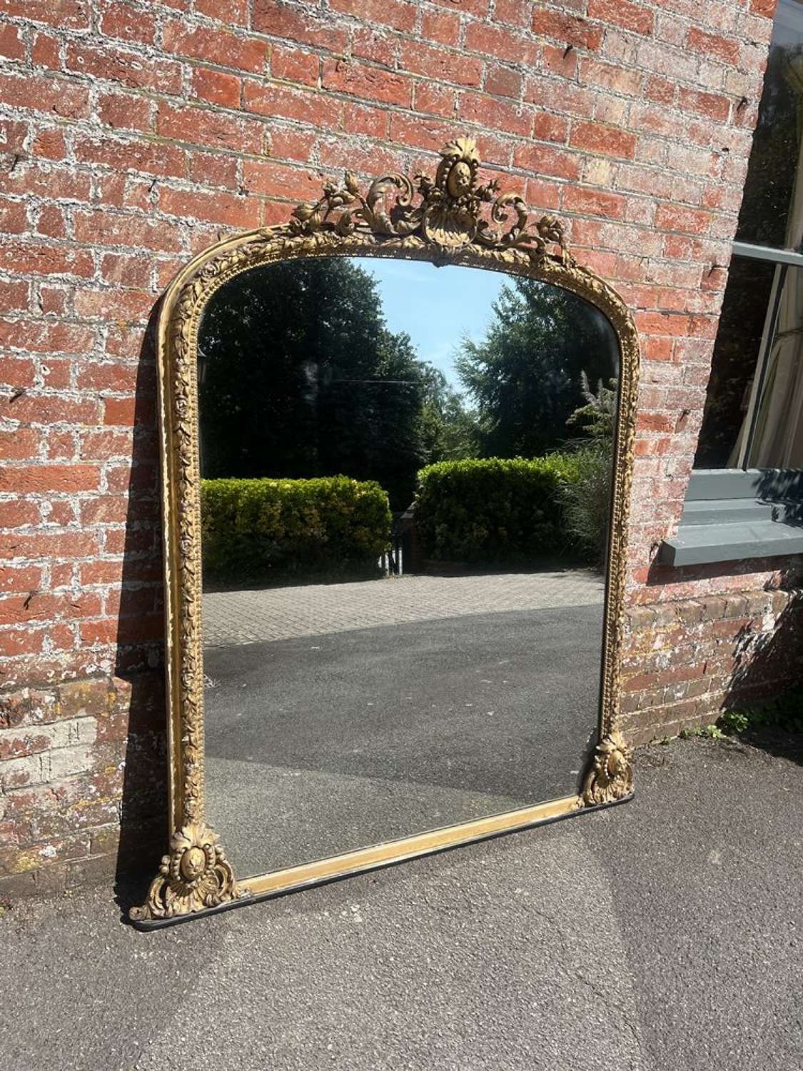 A Superb large Antique English 19th C arched gilt Overmantle Mirror.