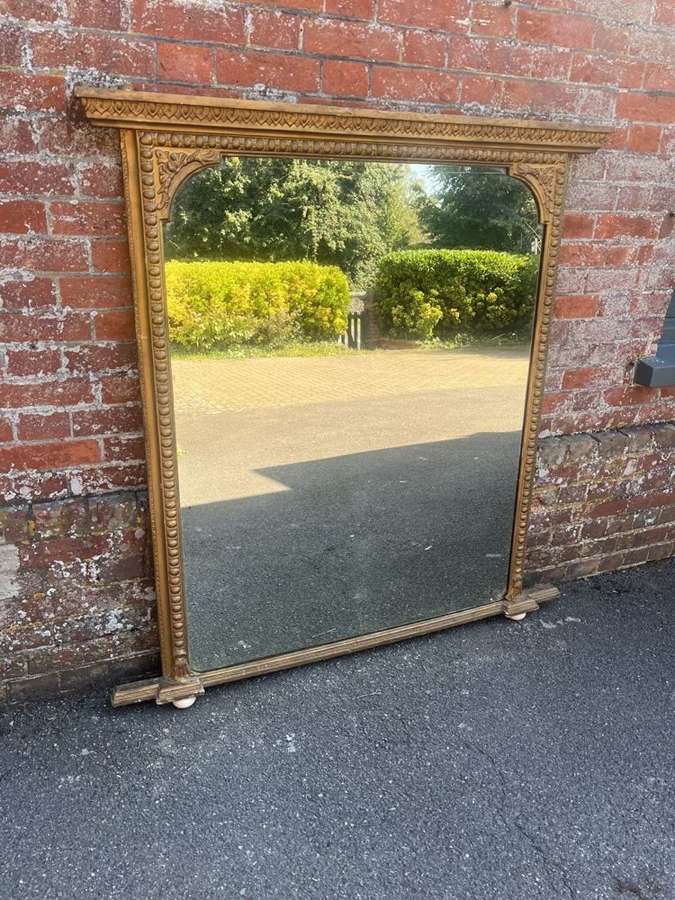 A Delightful large Antique English 19th C gilt Overmantle Mirror.