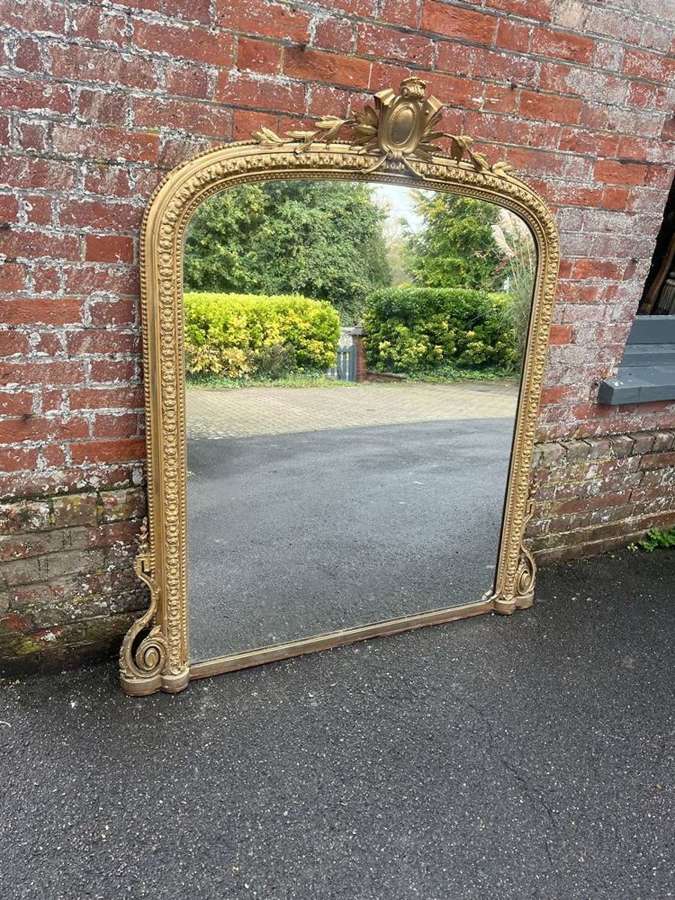 A Splendid large Antique English 19th C arched gilt Overmantle Mirror.