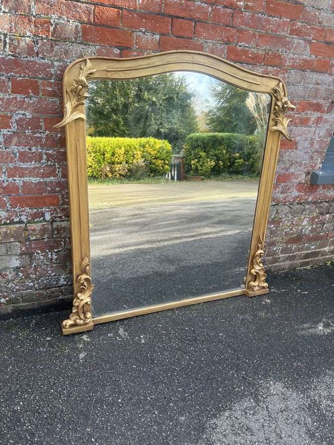 A Fabulous large Antique English 19th C gilt shaped Overmantle Mirror.