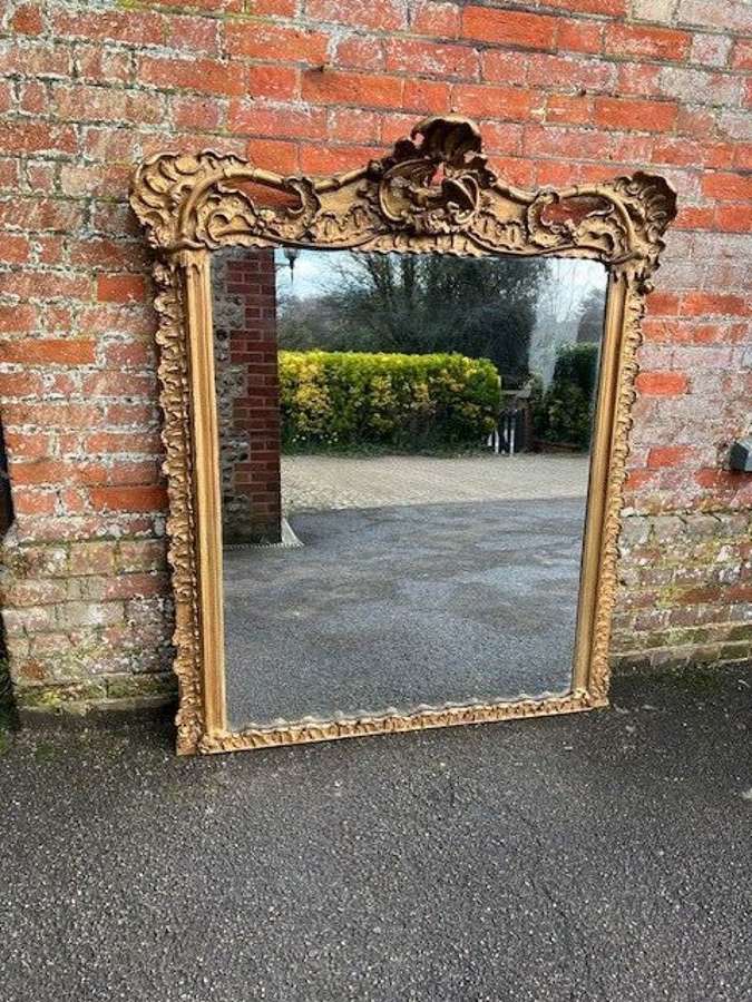 A Stunning large Antique English 19th C gilt shaped Overmantle Mirror.