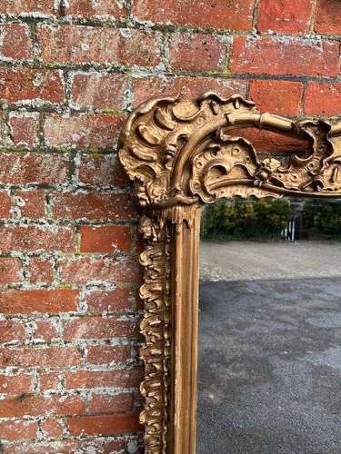 A Stunning large Antique English 19th C gilt shaped Overmantle Mirror.