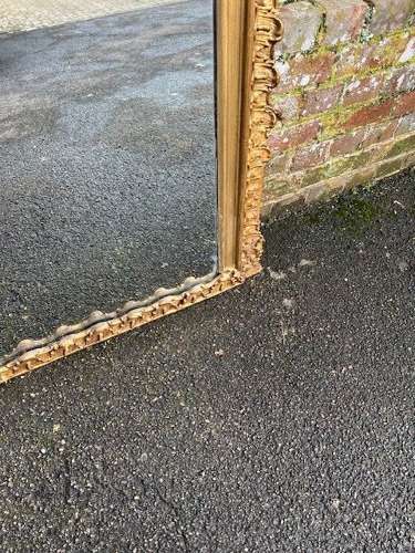 A Stunning large Antique English 19th C gilt shaped Overmantle Mirror.