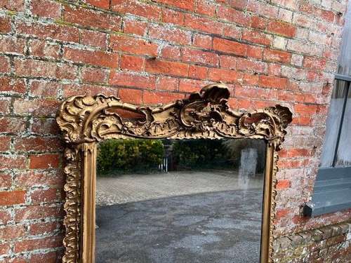 A Stunning large Antique English 19th C gilt shaped Overmantle Mirror.