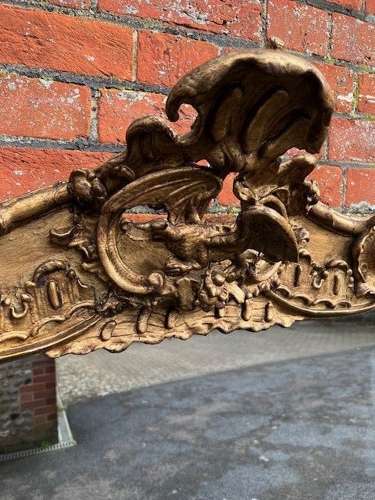 A Stunning large Antique English 19th C gilt shaped Overmantle Mirror.