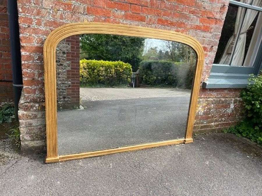 A Spectacular Antique English 19th C ribbed gilt Overmantle Mirror.