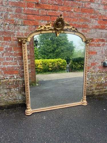 A Superb large Antique English 19th C shaped top original gilt Mirror.