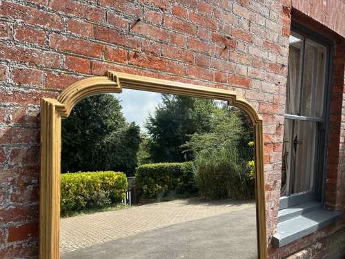 A Spectacular large Antique English 19th C shaped top gilt Mirror.