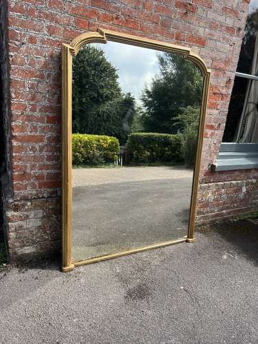 A Spectacular large Antique English 19th C shaped top gilt Mirror.