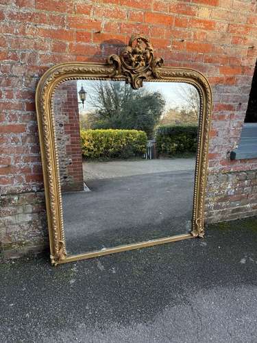 A Spectacular large Antique English 19th C arched top gilt Mirror.