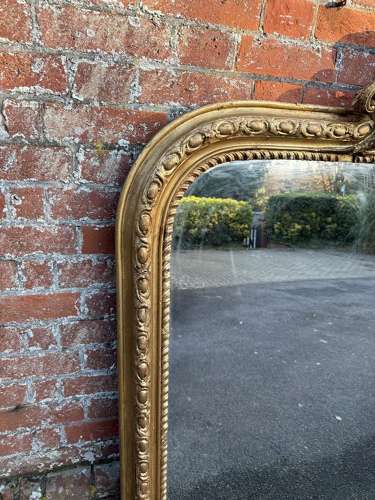 A Spectacular large Antique English 19th C arched top gilt Mirror.