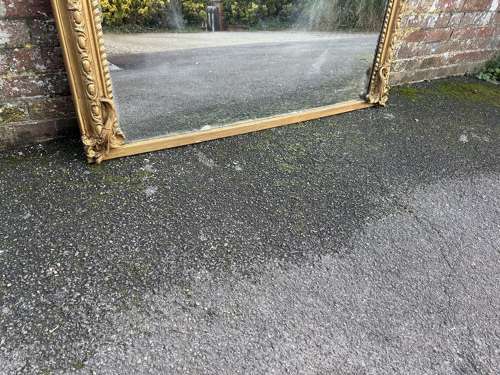 A Spectacular large Antique English 19th C arched top gilt Mirror.