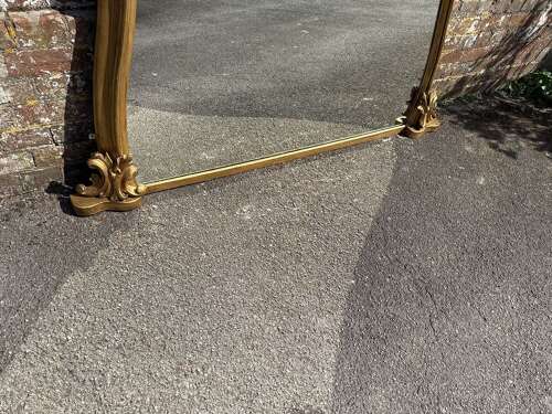 A Spectacular large Antique English 19th C shaped gilt Overmantle Mirror.