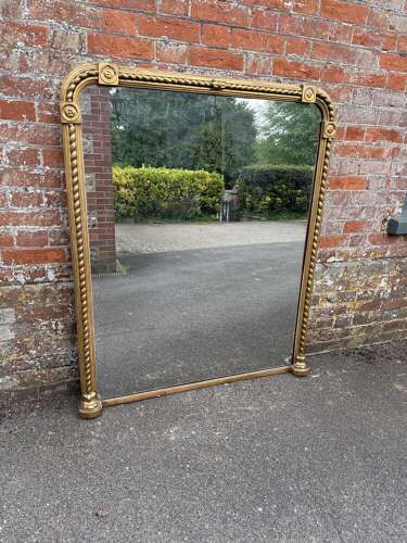 A Stunning large Antique English 19th C arched top rope twist gilt Overmantle Mirror.