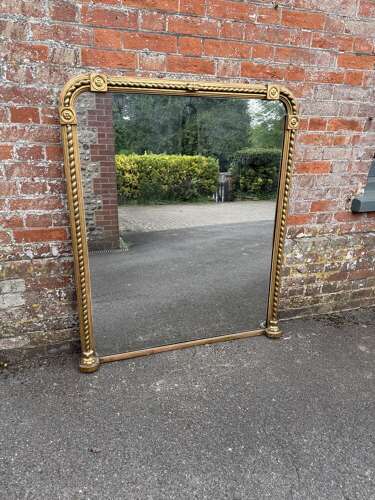 A Stunning large Antique English 19th C arched top rope twist gilt Overmantle Mirror.