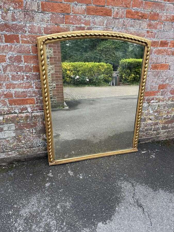 A Fabulous large Antique English 19th C shaped top beaded framed gilt Overmantlel Mirror.