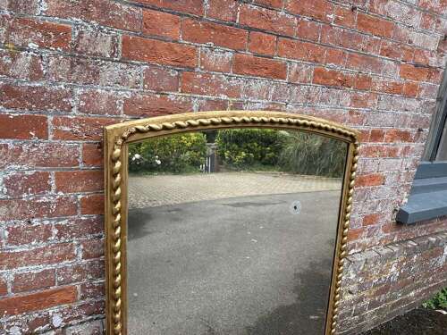 A Fabulous large Antique English 19th C shaped top beaded framed gilt Overmantlel Mirror.