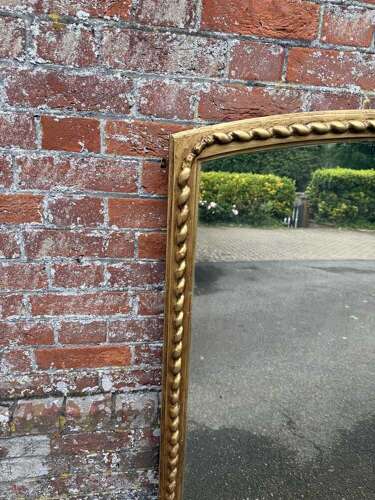 A Fabulous large Antique English 19th C shaped top beaded framed gilt Overmantlel Mirror.