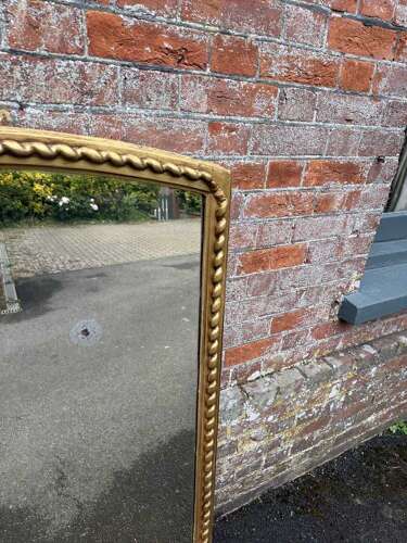 A Fabulous large Antique English 19th C shaped top beaded framed gilt Overmantlel Mirror.