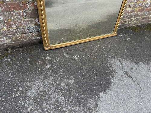 A Fabulous large Antique English 19th C shaped top beaded framed gilt Overmantlel Mirror.
