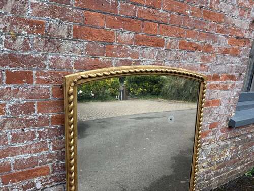A Fabulous large Antique English 19th C shaped top beaded framed gilt Overmantlel Mirror.