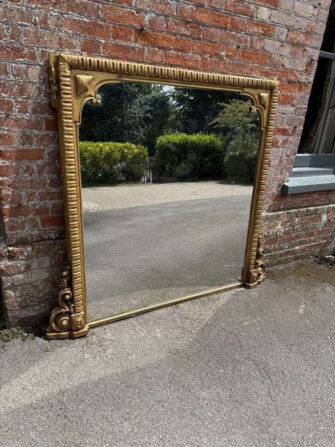 A Stunning large Antique English 19th C gilt ribbed framed Overmantle Mirror.