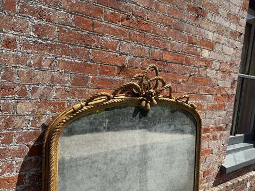 An Exceptional large Antique English 19th C arched top gilt rope twist Overmantle Mirror.