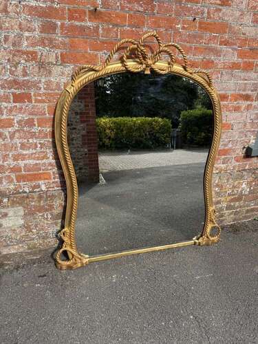 A Spectacular large Antique English 19th C hour glass shaped gilt Overmantle Mirror.
