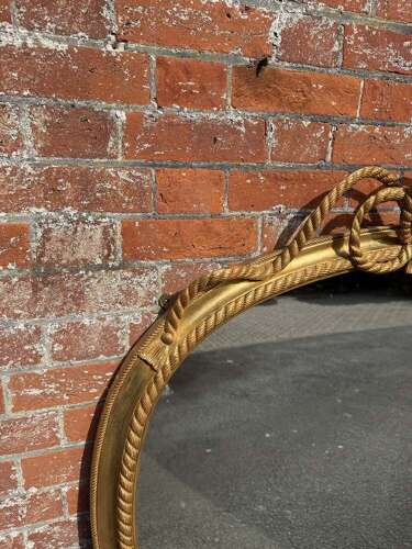 A Spectacular large Antique English 19th C hour glass shaped gilt Overmantle Mirror.