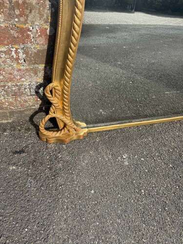 A Spectacular large Antique English 19th C hour glass shaped gilt Overmantle Mirror.