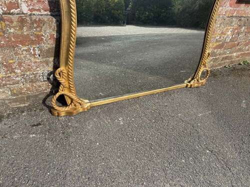 A Spectacular large Antique English 19th C hour glass shaped gilt Overmantle Mirror.