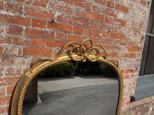 A Spectacular large Antique English 19th C hour glass shaped gilt Overmantle Mirror.