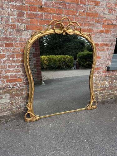 A Spectacular large Antique English 19th C hour glass shaped gilt Overmantle Mirror.