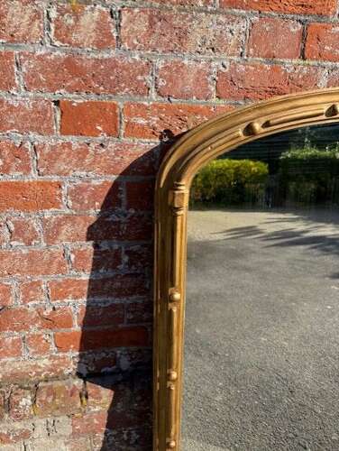 A Delightful large Antique Large English 19th C arched top gilt Overmantle Mirror.