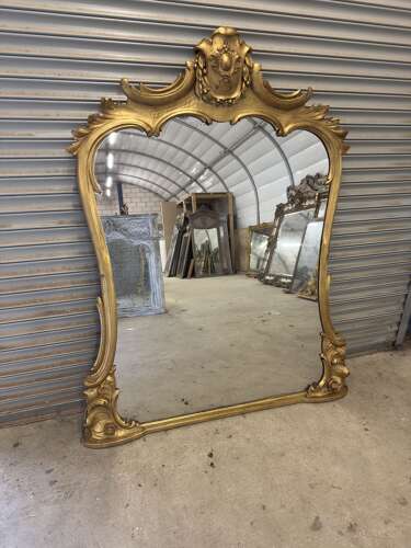 AN Exceptional large Antique English 19th Century gilt shaped Mirror.