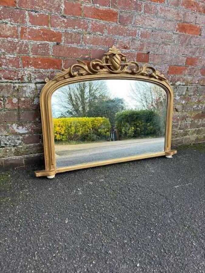 A Delightful sizes Antique English 19th C arched top gilt Overmantle Mirror.