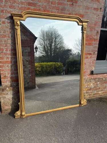 An Exceptional large Antique English 19th Century gilt ribbed Overmantle Mirror.